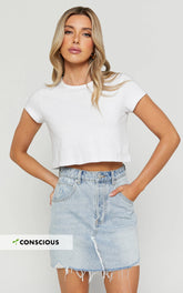 Pieta Mini Skirt - Recycled Cotton Raw Hem Denim Skirt in Mid Blue Wash
