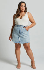 Pieta Mini Skirt - Recycled Cotton Raw Hem Denim Skirt in Mid Blue Wash