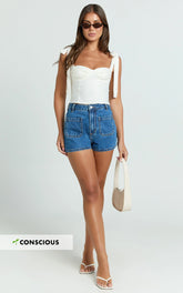 Avril Shorts - High Waisted Recycled Denim Patch Pocket Micro Shorts in Mid Blue Wash