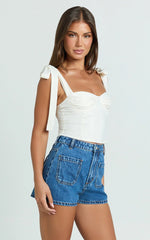 Avril Shorts - High Waisted Recycled Denim Patch Pocket Micro Shorts in Mid Blue Wash
